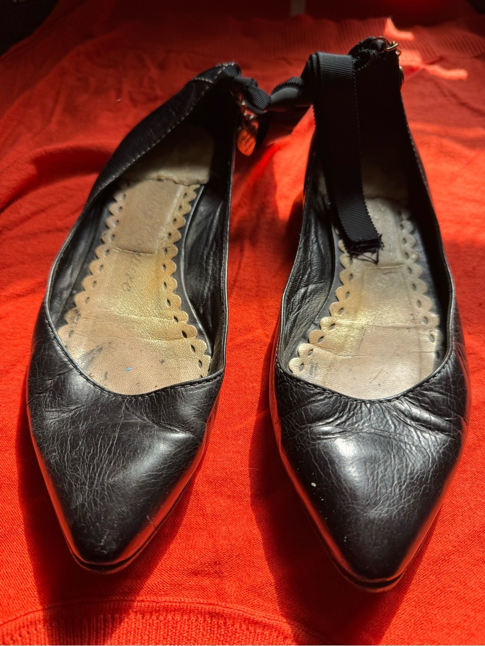 Juicy Couture Black Leather, Pointed Toe Women's Flats with ribbon ankle ties.